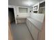 Finished basement featuring built-in storage and access to the staircase at 2827 Se 2Nd St, Ocala, FL 34471