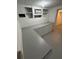 Finished basement with ample storage, counter space, and window A/C unit at 2827 Se 2Nd St, Ocala, FL 34471