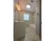 Updated bathroom with marble floors, stylish vanity, and shower-tub combo at 2827 Se 2Nd St, Ocala, FL 34471