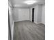 Bedroom featuring hardwood flooring, bi-fold closet doors, and a ceiling fan at 2827 Se 2Nd St, Ocala, FL 34471