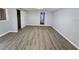 Bright bedroom with light wood-look flooring and a closet for ample storage at 2827 Se 2Nd St, Ocala, FL 34471