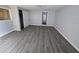 Bedroom featuring gray wood floors, closet, and neutral paint at 2827 Se 2Nd St, Ocala, FL 34471