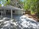 Spacious carport area providing covered parking and access to the backyard at 2827 Se 2Nd St, Ocala, FL 34471