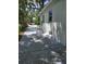 Exterior side view of the home showing the driveway, new paint and landscaping at 2827 Se 2Nd St, Ocala, FL 34471
