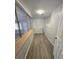 Well-lit laundry room with large window and gray plank flooring at 2827 Se 2Nd St, Ocala, FL 34471