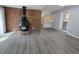 Comfortable living room with wood floors, a brick fireplace and open floor plan at 2827 Se 2Nd St, Ocala, FL 34471