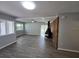 Spacious living room with fireplace, wood floors, and neutral paint at 2827 Se 2Nd St, Ocala, FL 34471