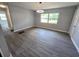 Open living area featuring hardwood floors, modern lighting, and a sliding glass door at 2827 Se 2Nd St, Ocala, FL 34471