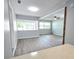 Bright open living area with a fireplace, lots of natural light, and views outside at 2827 Se 2Nd St, Ocala, FL 34471