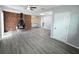 Bright living room with exposed brick fireplace and modern gray floors at 2827 Se 2Nd St, Ocala, FL 34471