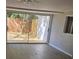 Living room features hardwood flooring, sliding doors to the outdoors, and a ceiling fan at 2827 Se 2Nd St, Ocala, FL 34471