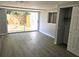 Living room featuring hardwood flooring, sliding doors to a patio, and closet space at 2827 Se 2Nd St, Ocala, FL 34471