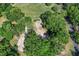 Aerial view of a partially cleared lot ready for development near a tree-lined street at 8596 Sw 108Th Place Rd, Ocala, FL 34481