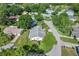 Overhead view of a home with mature trees, a nicely landscaped yard, and a peaceful neighborhood setting at 8596 Sw 108Th Place Rd, Ocala, FL 34481