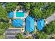 Aerial view of community pool with ample parking, pool deck, and lounge chairs surrounded by trees at 8596 Sw 108Th Place Rd, Ocala, FL 34481
