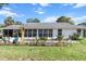 Spacious backyard with a screened porch and decorative landscaping at 8596 Sw 108Th Place Rd, Ocala, FL 34481