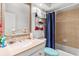 Bathroom with a vanity, mirror, shower and blue accents at 8596 Sw 108Th Place Rd, Ocala, FL 34481
