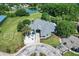 Aerial view of community clubhouse with manicured grounds, providing a tranquil social and recreational space at 8596 Sw 108Th Place Rd, Ocala, FL 34481