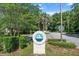 Community sign for the Aquatic Sports Club with lush landscaping and a tranquil atmosphere at 8596 Sw 108Th Place Rd, Ocala, FL 34481