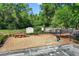 Dog park featuring wood-chipped ground, pet wash station, benches, and signage in a pet friendly area at 8596 Sw 108Th Place Rd, Ocala, FL 34481