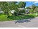 Attractive home surrounded by mature trees, with a well-kept lawn and inviting curb appeal at 8596 Sw 108Th Place Rd, Ocala, FL 34481
