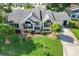 Charming home featuring a manicured lawn, lovely landscaping, and an inviting front entrance at 8596 Sw 108Th Place Rd, Ocala, FL 34481