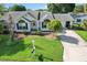 Charming single-story home with a lush green lawn and mature trees at 8596 Sw 108Th Place Rd, Ocala, FL 34481