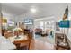 Open living space featuring a dining area and a sunny sunroom, perfect for Gathering gatherings and relaxed living at 8596 Sw 108Th Place Rd, Ocala, FL 34481