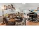 Comfortable living room featuring hardwood floors, seating and natural light at 8596 Sw 108Th Place Rd, Ocala, FL 34481