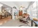Cozy sunroom with comfortable seating featuring a living area, a piano, and a dining area perfect for relaxing and entertaining at 8596 Sw 108Th Place Rd, Ocala, FL 34481