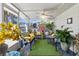 Relaxing sunroom with comfortable seating and lush plants at 8596 Sw 108Th Place Rd, Ocala, FL 34481