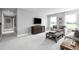 Cozy living room with comfortable seating, modern decor, and ample natural light at 1204 Ivy Manor St, Minneola, FL 34715