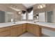 Spacious bathroom with dual sinks, decorative lighting, and a large vanity at 1424 Figueroa St, The Villages, FL 32162