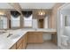 Spacious bathroom featuring double sinks, large mirrors, and ample counter space at 1424 Figueroa St, The Villages, FL 32162