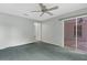 Carpeted bedroom with a sliding glass door leading to an outdoor space at 1424 Figueroa St, The Villages, FL 32162