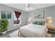 Bedroom with white bedding, plants, side tables and neutral color scheme at 1424 Figueroa St, The Villages, FL 32162