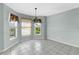 Sunny dining area with large windows and tile flooring at 1424 Figueroa St, The Villages, FL 32162