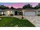 Beautiful home featuring a well-manicured lawn and an elegant stone-paved driveway at 1424 Figueroa St, The Villages, FL 32162