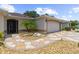 Charming home featuring a meticulously designed walkway and a well-manicured yard at 1424 Figueroa St, The Villages, FL 32162