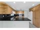 Kitchen with granite countertops, oak cabinets, and stainless steel appliances at 1424 Figueroa St, The Villages, FL 32162