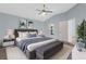 Comfortable main bedroom suite features a large bed and stylish decor at 1424 Figueroa St, The Villages, FL 32162