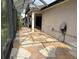 Enclosed patio featuring stone-patterned flooring at 1424 Figueroa St, The Villages, FL 32162