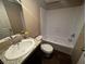 Bathroom with a large sink and a bathtub at 3346 Se 131St Pl, Belleview, FL 34420
