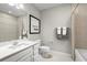 Spotless bathroom with neutral color tones, a shower/tub combo, ample countertop space and large vanity at 454 Hammock Oaks Blvd, Lady Lake, FL 32159