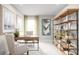 Well-appointed home office with a modern desk, shelving unit, and ample natural light for productivity at 454 Hammock Oaks Blvd, Lady Lake, FL 32159