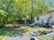 Spacious backyard featuring mature trees, a shed, and plenty of room to roam at 801 Nw 16Th Ct, Ocala, FL 34475