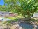 Backyard featuring a hammock under the shade of a large tree at 801 Nw 16Th Ct, Ocala, FL 34475