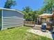 Backyard with a shed, patio, and green grass at 801 Nw 16Th Ct, Ocala, FL 34475