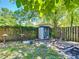 Backyard with a shed, green grass, and privacy fence at 801 Nw 16Th Ct, Ocala, FL 34475