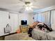 Comfortable bedroom featuring a closet, ceiling fan, and carpeted floors at 801 Nw 16Th Ct, Ocala, FL 34475
